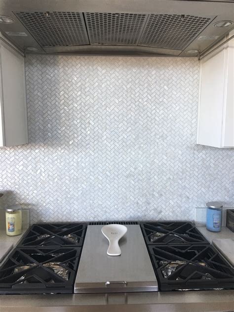 mother of pearl herringbone tile|groutless mother of pearl backsplash.